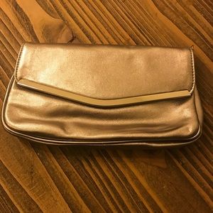 Gold clutch handbag